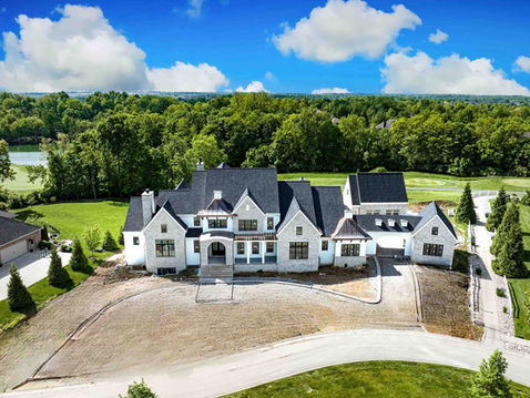 Aerial view of a luxury custom home under construction by Frazier Homes, illustrating how change orders impact residential construction timelines, costs, and planning decisions.
