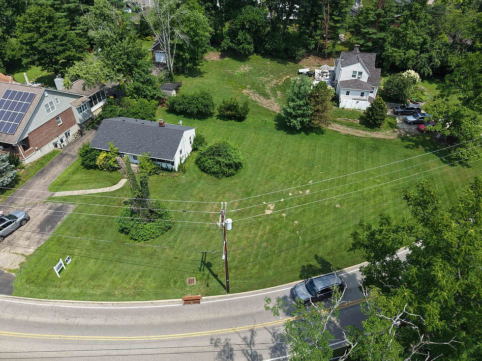 Aerial view of the Dawson Road homesite in Madeira, Ohio, showing the spacious residential lot surrounded by mature trees and neighboring homes.