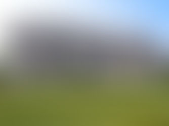 Luxury custom home exterior by Frazier Homes showcasing lean construction principles, with balanced architecture, refined brick detailing, and intentional design rooted in efficiency and craftsmanship.