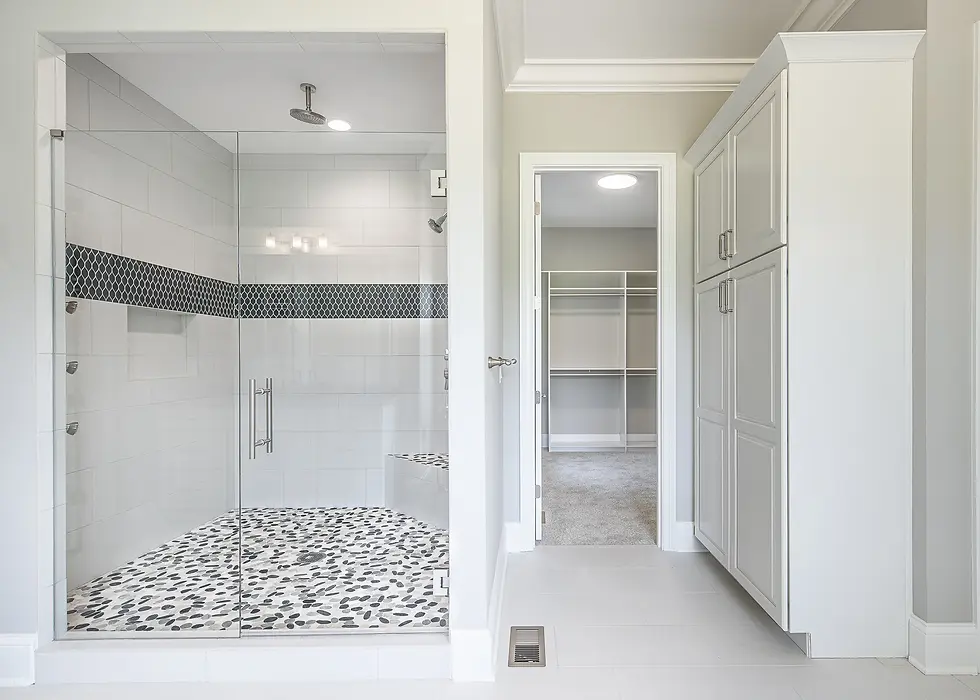 Hyde Park master bathroom with glass-enclosed luxury shower, black and white mosaic tile, and custom cabinetry in a Frazier Homes custom home, Cincinnati Ohio.