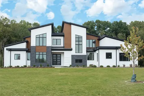 Modern luxury custom home in Indian Hill, Ohio built by Frazier Homes, showcasing contemporary architecture, innovative design, and exceptional craftsmanship.
