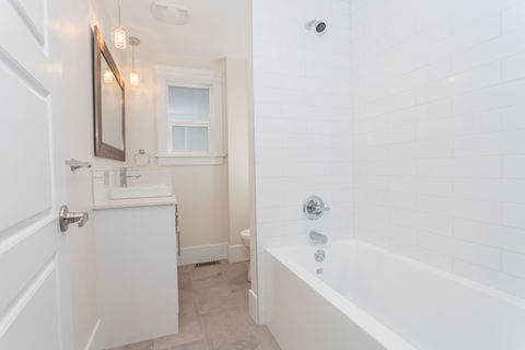 Compact and modern basement washroom with stylish fixtures and efficient use of space.