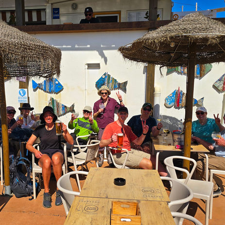 Group of hikers relaxing at an outdoor cafe in Portugal