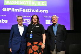 Three people at the GI Film Festival in Washington, D.C.