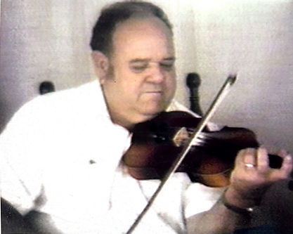 Jessie Arabie Sr. playing the fiddle