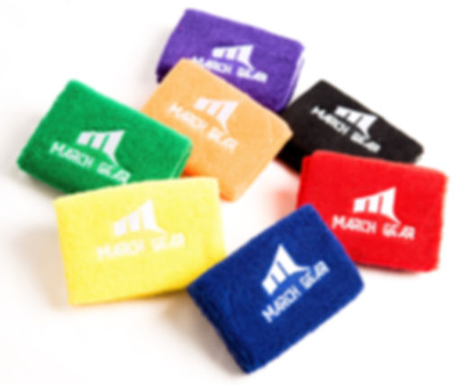 collection of wrist bands, yellow, green orange, purple, black, red, and blue
