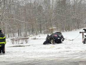 Vehicle Enters Pond in Lyman; Occupants Exit Safely