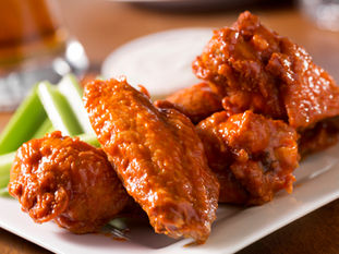 Extra crispy buffalo chicken wings — golden double-fried wings with homemade buffalo sauce
