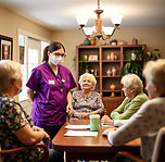 caregiver with purple scrubs supervising up to 6 seniors in a home.jpg