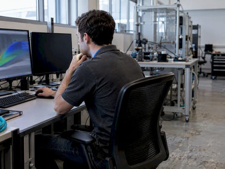 Engineer reviewing CFD wall mesh results