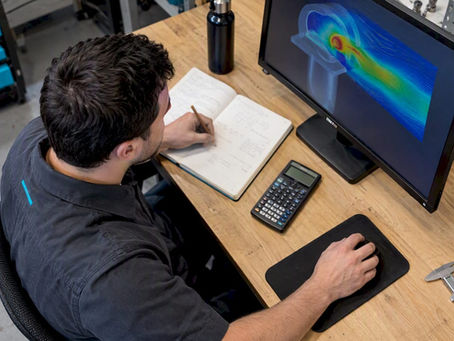 Engineer comparing hand calculations with CFD
