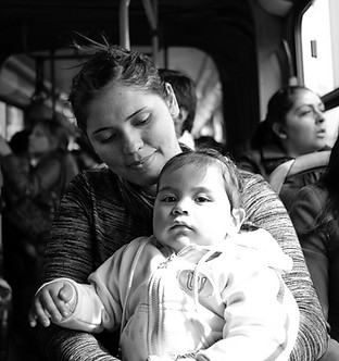 A mother and daugher on a bus
