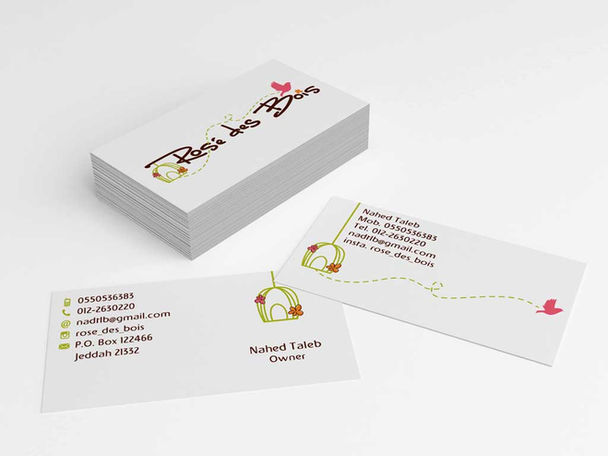 Business card layout for an organic baby-clothing boutique featuring a playful bird-cage logo.