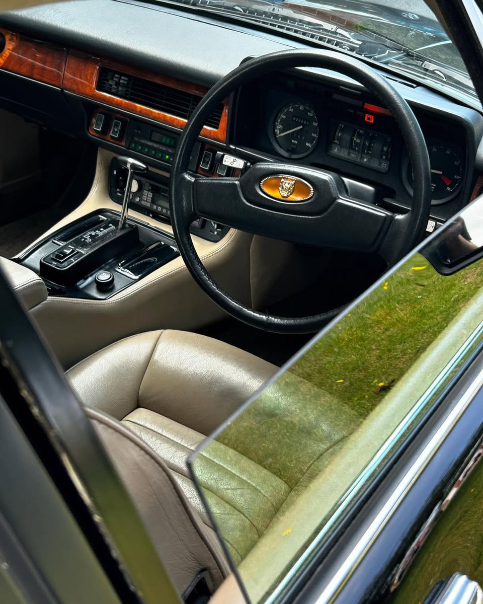 aguar XJS interior featuring a polished wooden dashboard and spotless leather seats after expert interior valeting.