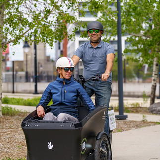 Woman in a Triobike Boxter cargo bike.