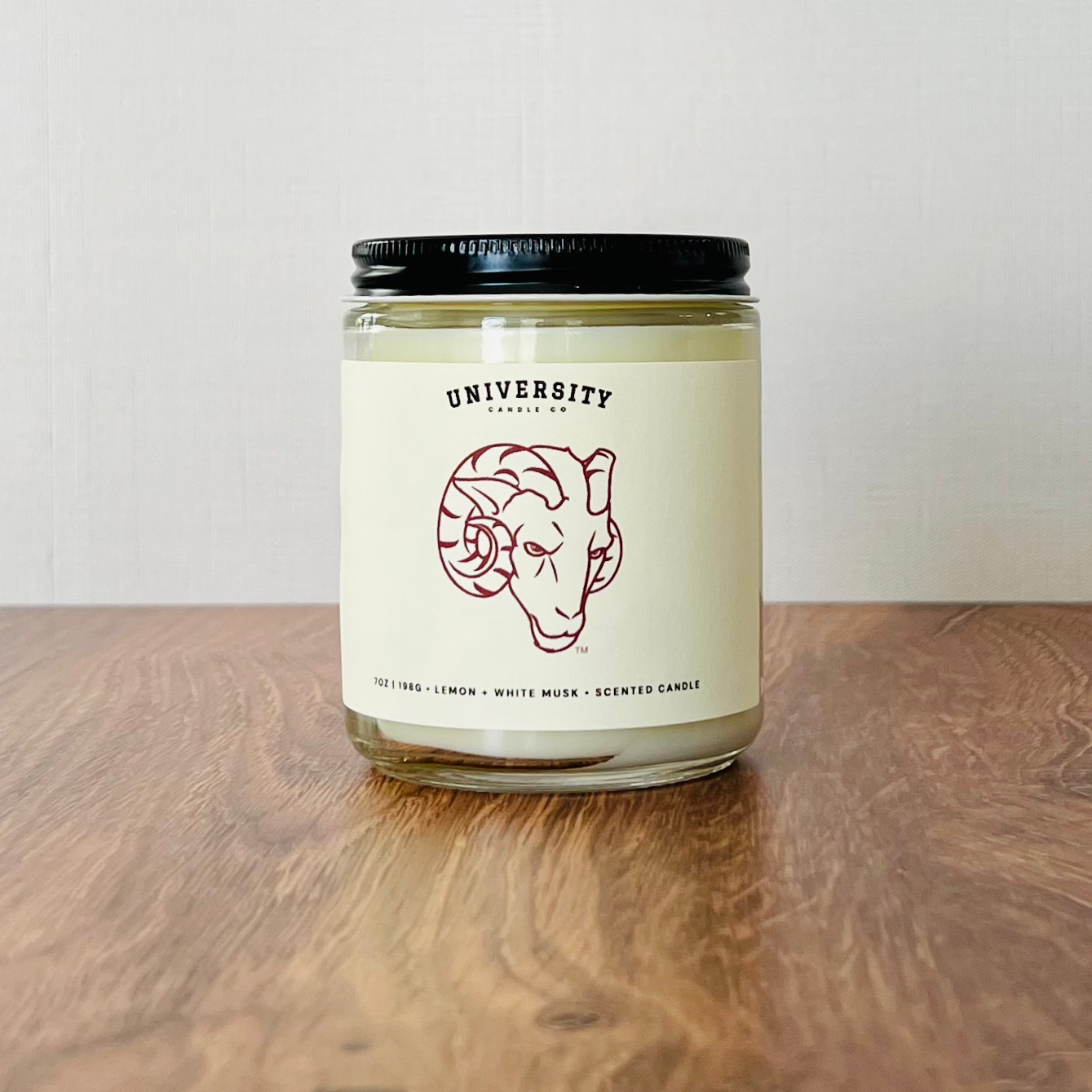 University Candle Co. ram logo candle, citrus, lemon, musk scent.