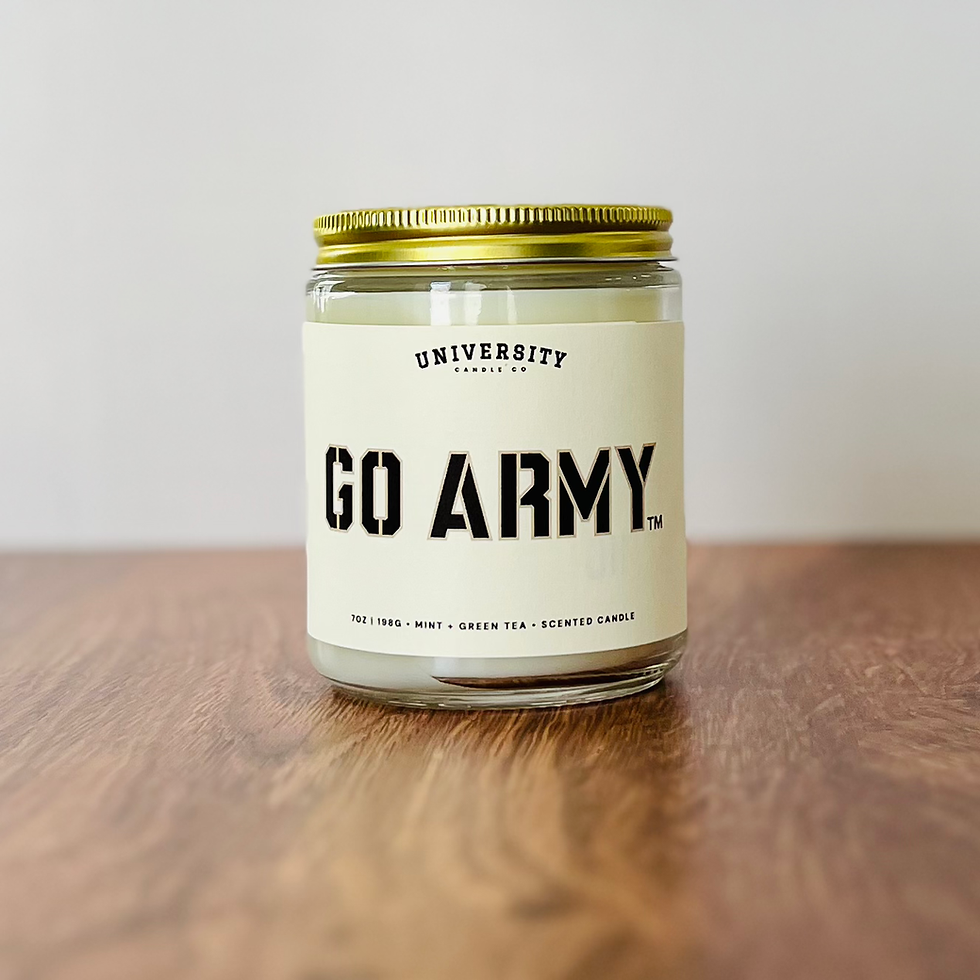 Glass jar candle "UNIVERSITY CANDLE CO. GO ARMY." on wood.