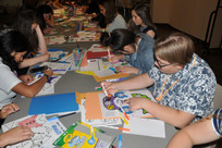 Students coloring activity books.