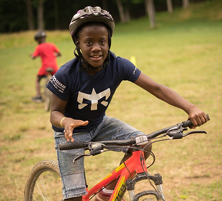 a camper on a bike