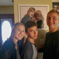 Family at home in the driveway