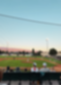 Baseball game at a local community field in Commercial Point, Ohio during summer evening festivities
