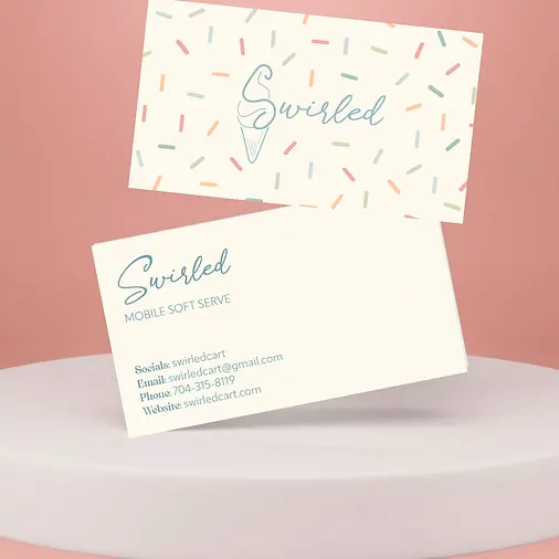 Swirled Soft Serve business cards featuring playful branding elements and vibrant colors, displayed on a pink background.