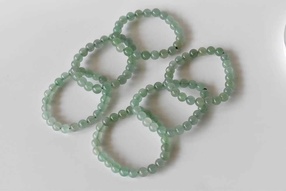 Thumbnail: 6 green adventurine bracelets laid out next to each other