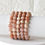 Thumbnail: four moonstone bracelets hanging next to eachother