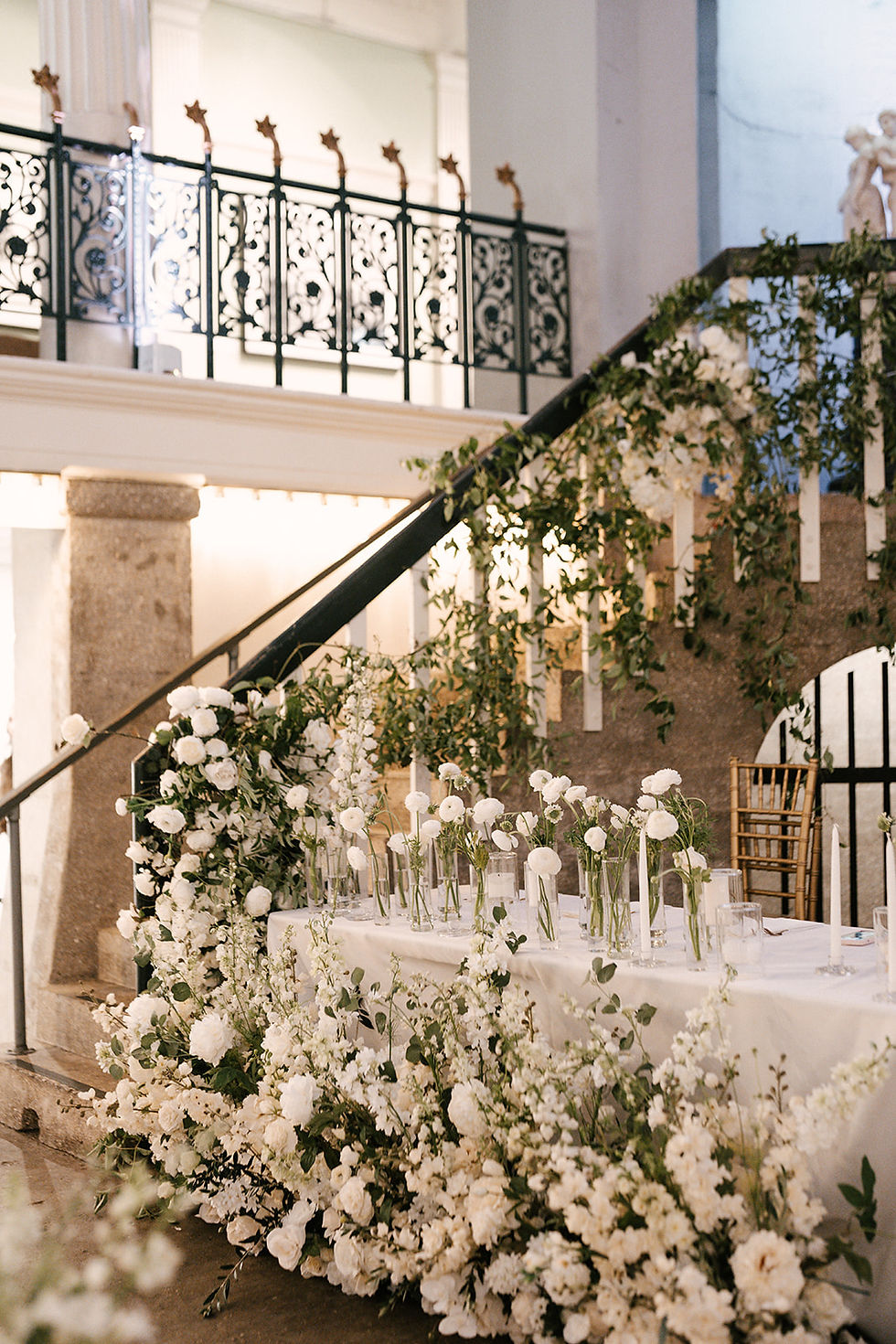 st. augustine. lightner museum. ceremony in the pool. lush white florals. delphiniums, ranunculus, greenery, modern