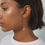 Thumbnail: Woman wearing elegant gold earrings