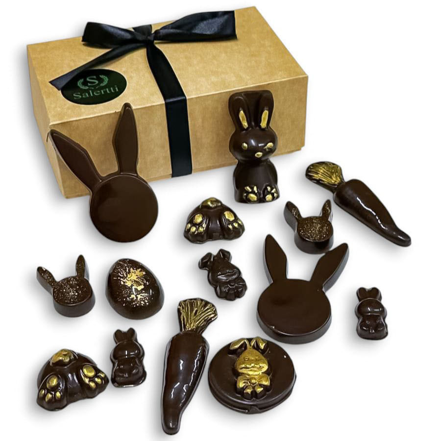 Caja de chocolates sin azúcar con figuras de conejos y huevos de Pascua, elaborados con chocolate de alta calidad.