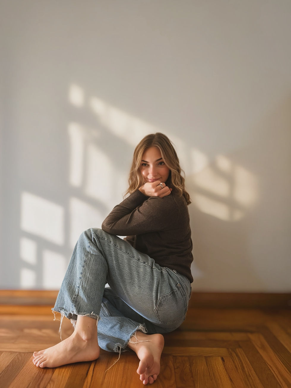 Antonia Bagoje sitting at home in the afternoon light, reflecting on life and motherhood
