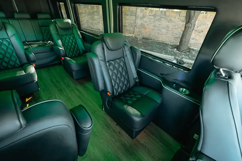 Luxury Mercedes Sprinter van interior: black leather seating, green floor