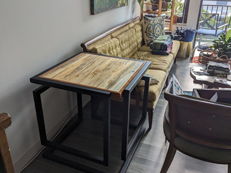 Custom designed end table with continuous loop frame design.