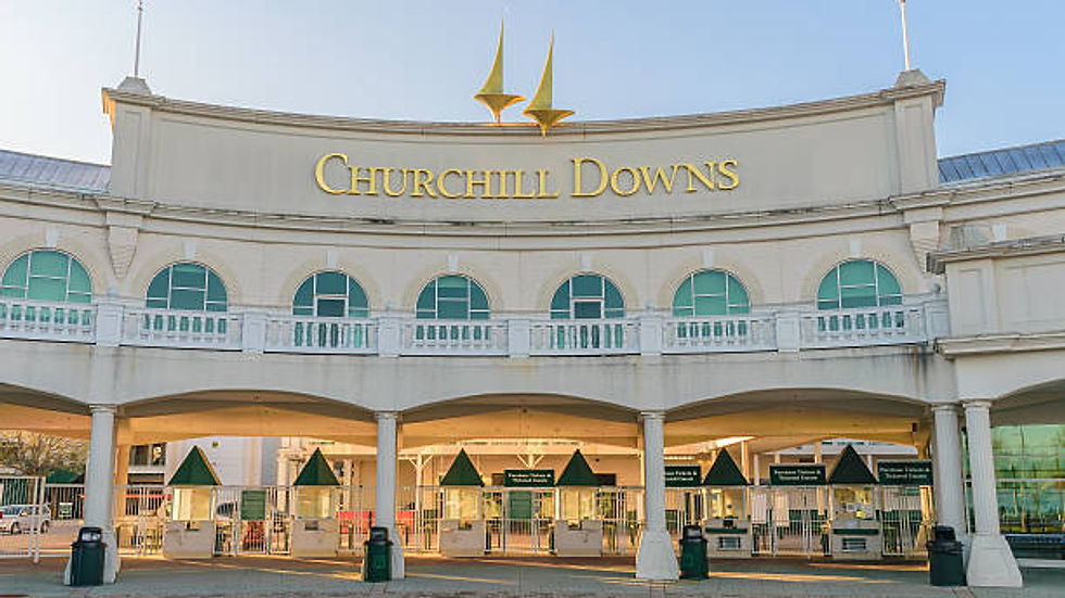 Crowd at a horse race event cheering with horses in action — perfect context for custom folding hand fans and promotional giveaways at the Kentucky Derby.