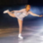 Skater from Dream Detroit Skating Club in a spiral pose