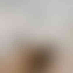 a beautiful, modern kitchen with white and grey granite countertops. an island centering the kitchen with 2 bar stools and a wooden base. a modern black rectangular light fixture overhead. white, inset cabinetry throughout with a subway tile backsplash on white oak luxury vinyl plank flooring