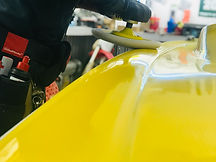 Bugging wheel gliding across yellow boat