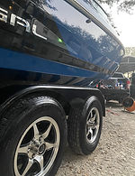 Side of blue boat after detailing service.