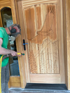 Miami custom wood door being sanded and restored.