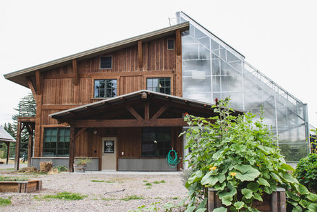 Miami home exterior with wood siding and deep covered porch.