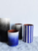 spray and graphic stripe vases
