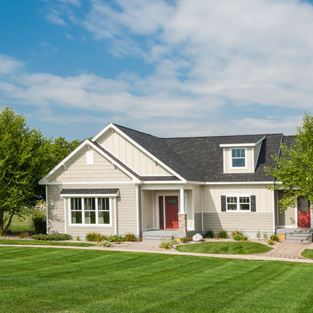 Large modular home with lawn and landscaping