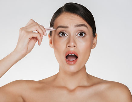 beauty-portrait-pretty-half-naked-woman-with-brown-hair-yelling-pain-while-plucking-eyebro