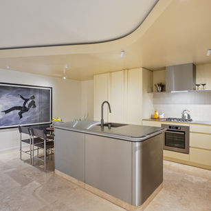 Kitchen display fitout in Mermaid Beach near Nobby's Beach Gold Coast by Barrile Building with modern cabinetry and stone benchtop