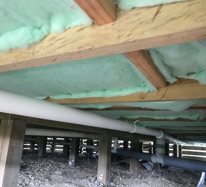 Underside of house with insulation installed.