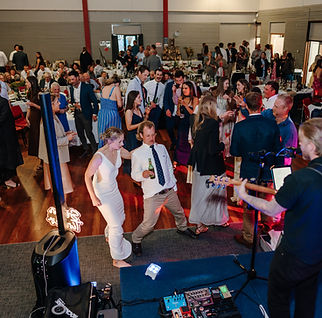 Sean Tinker performing at a busy wedding in Central Otago.