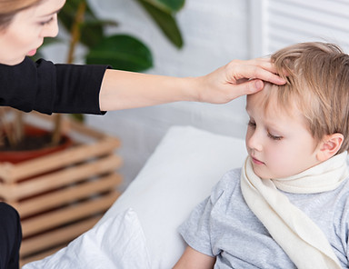 worried-woman-checking-child-s-temperature-at-home-2026-03-11-04-15-14-utc.jpg