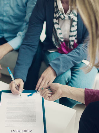 First-time homebuyer signing closing documents