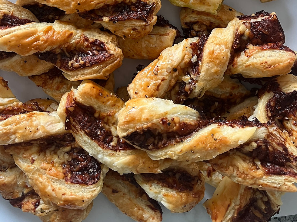 A tray of golden-brown cheese & marmite puff pastry twists